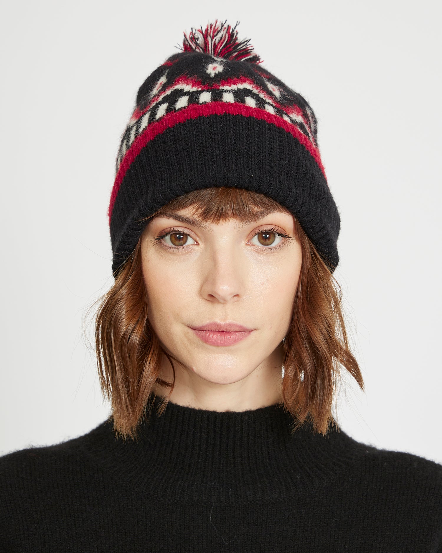 Knitted cap with pom-pom